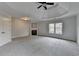 This bedroom is complete with a fireplace, large window, and recessed ceilings at 2723 Ivy Bluff Ct, Buford, GA 30519
