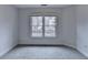 Serene bedroom with a large window and soft carpet, perfect for relaxation at 2723 Ivy Bluff Ct, Buford, GA 30519