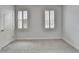 This bedroom features new carpet, a door, and a window with shutters at 2723 Ivy Bluff Ct, Buford, GA 30519
