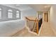 Large bonus room with stairs, and an abundance of light from the windows at 2723 Ivy Bluff Ct, Buford, GA 30519