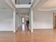 Spacious hallway with hardwood floors, decorative molding, and staircase at 2723 Ivy Bluff Ct, Buford, GA 30519