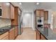 Kitchen featuring stainless appliances, breakfast bar, and hardwood floors at 2723 Ivy Bluff Ct, Buford, GA 30519