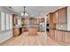 Spacious kitchen with stainless appliances, island and hardwood floors at 2723 Ivy Bluff Ct, Buford, GA 30519