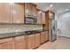 Kitchen featuring stainless appliances, granite countertops, and hardwood floors at 2723 Ivy Bluff Ct, Buford, GA 30519