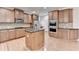 Kitchen featuring stainless appliances, island, and hardwood floors at 2723 Ivy Bluff Ct, Buford, GA 30519