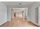 Bright living room features hardwood floors, neutral paint, and trim accents throughout the space at 2723 Ivy Bluff Ct, Buford, GA 30519