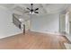 Spacious living room offers hardwood floors, coffered ceilings, and staircase leading to upper level at 2723 Ivy Bluff Ct, Buford, GA 30519