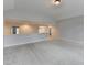 Open loft space with neutral walls and plush carpeting; ideal for relaxation or entertainment at 2723 Ivy Bluff Ct, Buford, GA 30519