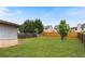 Wide shot of a large, well-maintained backyard with trees, grass and a privacy fence at 461 Summerstone Ln, Lawrenceville, GA 30044