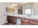 Large bathroom vanity with wooden cabinets and lots of countertop space at 461 Summerstone Ln, Lawrenceville, GA 30044