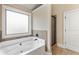 Modern soaking tub and shower at 461 Summerstone Ln, Lawrenceville, GA 30044
