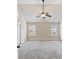Spacious bedroom with carpet, ceiling fan, and two windows at 461 Summerstone Ln, Lawrenceville, GA 30044