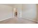 Neutral bedroom with a view through the open door to the staircase and landing at 461 Summerstone Ln, Lawrenceville, GA 30044
