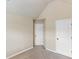 This bedroom features neutral walls, carpet and has 2 doors; one is partly paneled at 461 Summerstone Ln, Lawrenceville, GA 30044