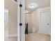 Hallway featuring carpeted floors, white doors, and staircase at 461 Summerstone Ln, Lawrenceville, GA 30044