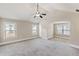 Spacious main bedroom with plush carpet, vaulted ceiling, and many windows at 461 Summerstone Ln, Lawrenceville, GA 30044