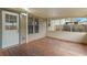 Covered patio with wood floors and natural light at 461 Summerstone Ln, Lawrenceville, GA 30044