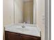 Cozy powder room with marble countertop vanity and neutral wall color at 461 Summerstone Ln, Lawrenceville, GA 30044