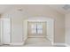 Sitting room with plush carpet, and a single window for natural light at 461 Summerstone Ln, Lawrenceville, GA 30044