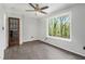 Inviting bedroom with wood floors, a large window, and a classic glass paneled door at 626 Mincey Ct, Stone Mountain, GA 30087