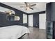 A bedroom with wood-look floors and dark walls, featuring a closet and bed at 626 Mincey Ct, Stone Mountain, GA 30087