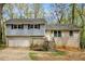 Charming split-level home with brick and siding, garage, and inviting front steps at 626 Mincey Ct, Stone Mountain, GA 30087