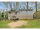 Back exterior view of the brick home with a spacious yard at 626 Mincey Ct, Stone Mountain, GA 30087
