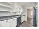Practical kitchen featuring sleek countertops, white cabinetry, and modern flooring at 626 Mincey Ct, Stone Mountain, GA 30087
