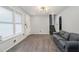 Inviting living room featuring wood floors, fresh paint, modern lighting, and staircase at 626 Mincey Ct, Stone Mountain, GA 30087