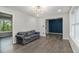 Bright living room featuring wood floors, fresh paint, and large picture window at 626 Mincey Ct, Stone Mountain, GA 30087