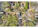 Aerial property view showcasing the home, pond, pier, and lot lines at 10845 Shallowford Rd, Roswell, GA 30075