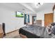 This bedroom is a cozy space with a mounted television and natural light at 10845 Shallowford Rd, Roswell, GA 30075