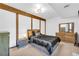 This bedroom is brightly lit with light-colored walls and dark wood trim at 10845 Shallowford Rd, Roswell, GA 30075