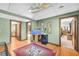 Bonus room features an aquarium, unique overhead lighting and a doorway leading to the main bedroom at 10845 Shallowford Rd, Roswell, GA 30075