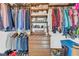 Walk-in closet featuring built-in shelving, drawers, and lots of space for storage at 10845 Shallowford Rd, Roswell, GA 30075