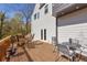Wooden deck with furniture and french doors to the interior at 10845 Shallowford Rd, Roswell, GA 30075