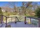 Scenic front yard view from the deck with green landscape and mature trees at 10845 Shallowford Rd, Roswell, GA 30075