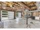 Spacious two-car garage with bright lighting, exposed ceiling and side door entrance at 10845 Shallowford Rd, Roswell, GA 30075