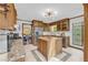 Traditional kitchen featuring wood cabinetry, granite countertops, and stainless steel appliances at 10845 Shallowford Rd, Roswell, GA 30075