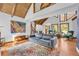 Spacious living room with high ceilings, large windows, and stylish furnishings at 10845 Shallowford Rd, Roswell, GA 30075