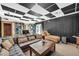 This large living room offers comfortable seating with views to other parts of the home at 10845 Shallowford Rd, Roswell, GA 30075