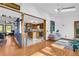 Open-concept living room features hardwood floors, bright kitchen, and modern decor at 10845 Shallowford Rd, Roswell, GA 30075