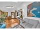 Bright living room with skylight, modern furnishings, and adjacent kitchen at 10845 Shallowford Rd, Roswell, GA 30075