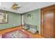 The room features hardwood floors, sage walls, and a unique ceiling with a decorative light panel at 10845 Shallowford Rd, Roswell, GA 30075