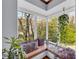 Cozy window seat in sunroom nook, perfect for reading and relaxation at 10845 Shallowford Rd, Roswell, GA 30075