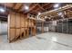 Unfinished basement, perfect for customization, with exposed framing and tile flooring at 1647 Grandeus Sw Ln, Stone Mountain, GA 30087