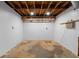 Unfinished basement, ready for customization, with concrete floor, exposed ceiling, and utility access at 1647 Grandeus Sw Ln, Stone Mountain, GA 30087