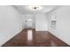 Bright bedroom with hardwood floors, white walls, and a large window at 1647 Grandeus Sw Ln, Stone Mountain, GA 30087