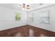 Bright bedroom with hardwood floors, crown molding, and plenty of natural light from the windows at 1647 Grandeus Sw Ln, Stone Mountain, GA 30087