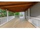Expansive wooden deck, perfect for outdoor entertaining, with natural light and railing at 1647 Grandeus Sw Ln, Stone Mountain, GA 30087